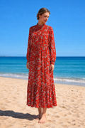 Red floral midi dress with white flower pattern, lightweight viscose and silk blend dress, loose flowing silhouette, long sleeve elegant summer dress, soft breathable fabric, red feminine dress Lithuania stilinga raudona gėlėta suknelė iš viskozės ir šilko, lengvai krentantis siluetas, ilgos rankovės, vasarinė elegantiška suknelė
